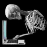 skeleton at computer
